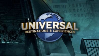 The Universal Destinations & Experiences logo, featuring a globe with gold text, is centered over a dark, dramatic scene with two shadowy figures and a staircase in the background as Universal Chicago coming in 2027.