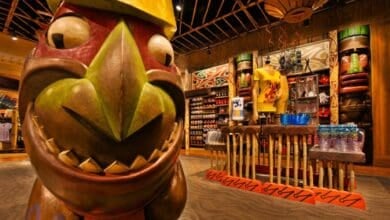 Colorful tiki statue in the foreground of BouTiki at Disney's Polynesian Village Resort