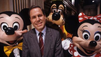 Michael Eisner with Mickey, Minnie, and Goofy