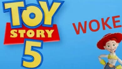 Logo for "Toy Story 5" on a blue background, with the word "WOKE" in red letters and the character Jessie, the cowgirl, standing and smiling on the right side.