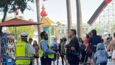 Disneyland Resort security talks to a drunk guest at Disney California Adventure Park.