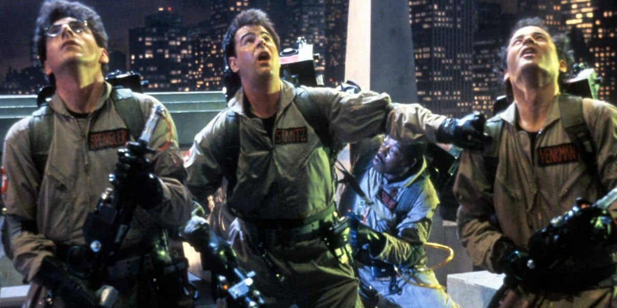 Four ghostbusters in tan jumpsuits from original 1984 film
