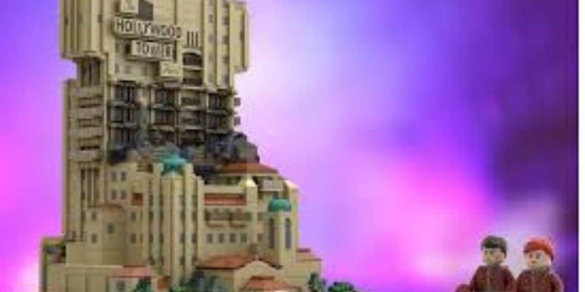 A LEGO model of the Hollywood Tower Hotel is displayed on the left, with two LEGO minifigures standing on the right, all set against a vibrant purple gradient background.