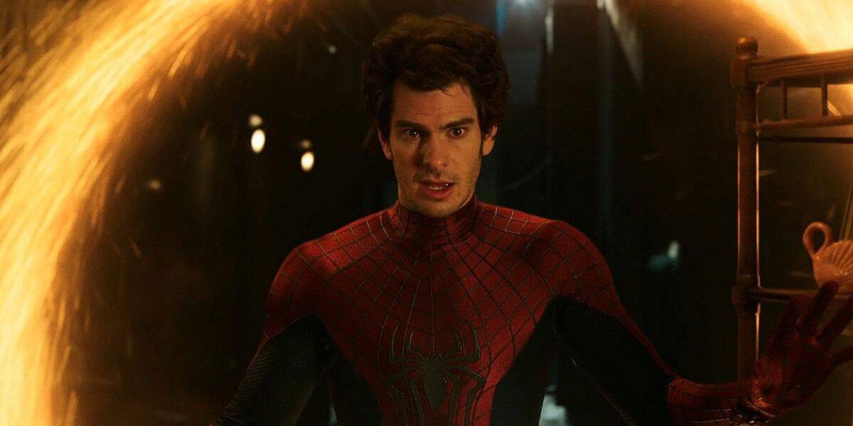 A person in a red and blue Spider-Man suit stands in front of a glowing, circular portal with sparks flying around the edges, looking surprised. The background is dimly lit, highlighting the iconic spider-man hero amid swirling energy.