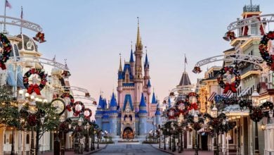 Main Street at Disney World decorated for the holidays, leading up to Cinderella Castle in Magic Kingdom.