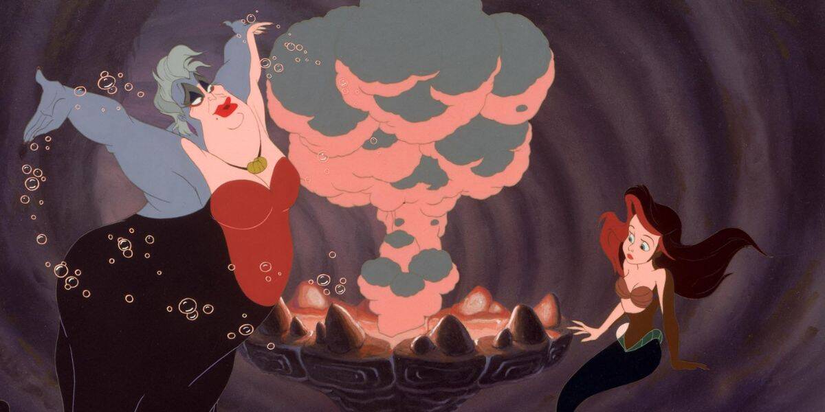A sea witch villain with pale skin and white hair gestures dramatically, creating a pink and gray smoke cloud from a shell cauldron, while a young mermaid with red hair watches in surprise inside an underwater cave.