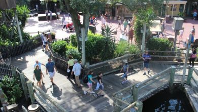 Guests walking along the pier in Frontierland at Magic Kingdom Park.