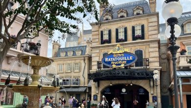 People stand in front of the entrance to Remy’s Ratatouille Adventure at EPCOT