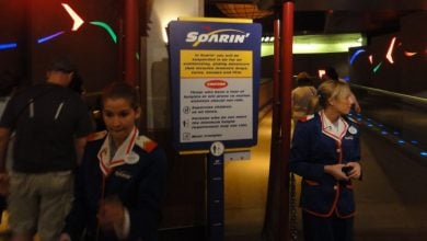 Two cast members in the old Soarin' costumes