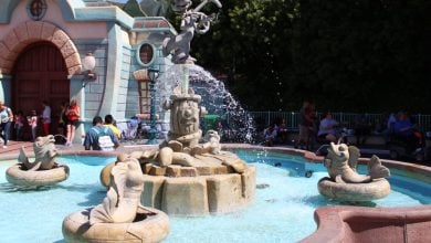Guests near the old fountain in Mickey's Toontown at Disneyland Park.