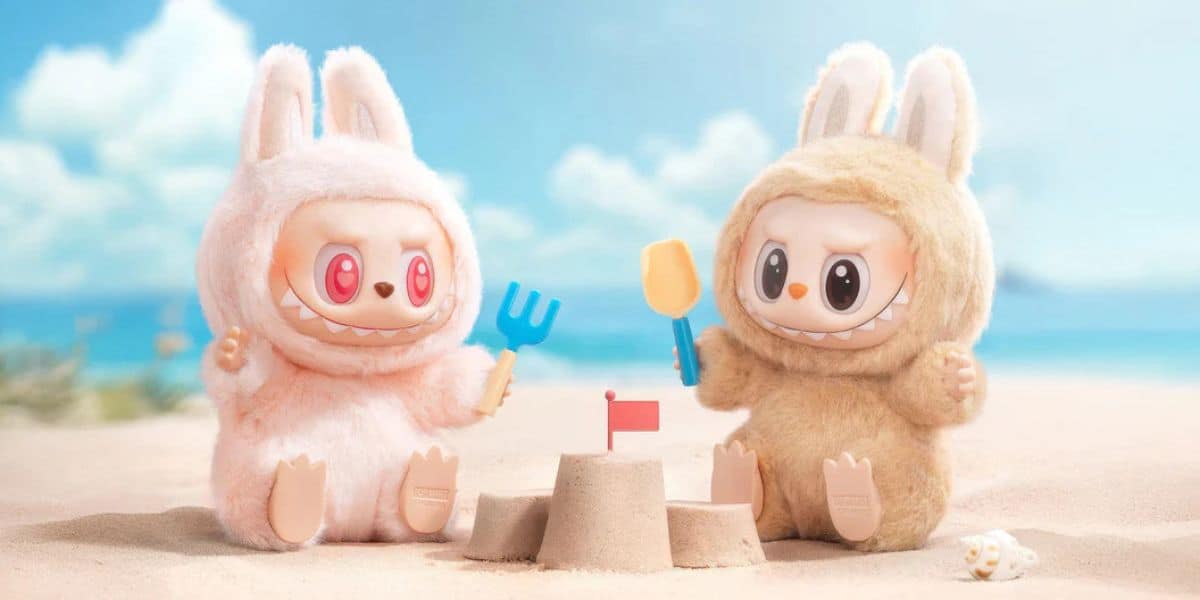 Two Labubu toys at the beach