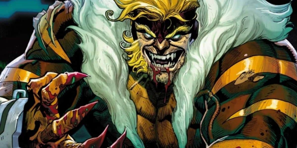 A muscular Marvel comic book character with wild blond hair, sharp fangs, and clawed hands snarls menacingly. He wears a fur-lined costume with tiger-like stripes and a large white mane around his neck.