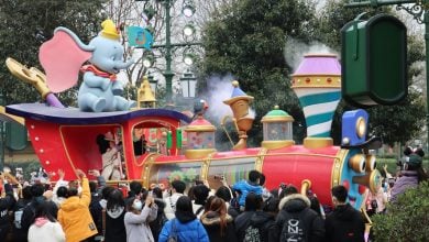 A 'Dumbo' parade float passes by guests at Shanghai Disneyland