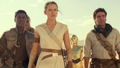 Finn, Rey and Poe stand together in front of C-3PO