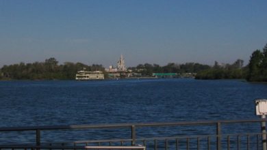 A ferry boat on the Seven Seas Lagoon at Walt Disney World Resort; Magic Kingdom is visible in the background.
