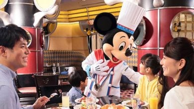 Guests meet Mickey Mouse during Chef Mickey's character dining experience at Tokyo Disney Resort