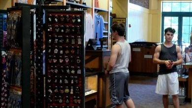 Men looking around a souvenir store at Walt Disney World Resort.