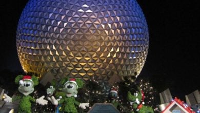 EPCOT's Spaceship Earth with Mickey Mouse and friends topiaries at Christmas time