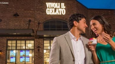 Guests savor delicious gelato outside Vivoli Il Gelato at Disney Springs, enjoying the lively nighttime atmosphere.