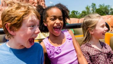 three kids ride Big Thunder Mountain in Disney World's Magic Kingdom park