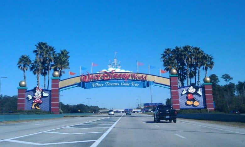 Walt Disney World entrance arch featuring Mickey and Minnie. Disney World weather.