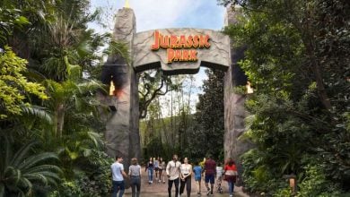 guests pass Jurassic Park gate entrance in Universal Orlando's Islands of Adventure park. Universal Islands of Adventure closures 2026.