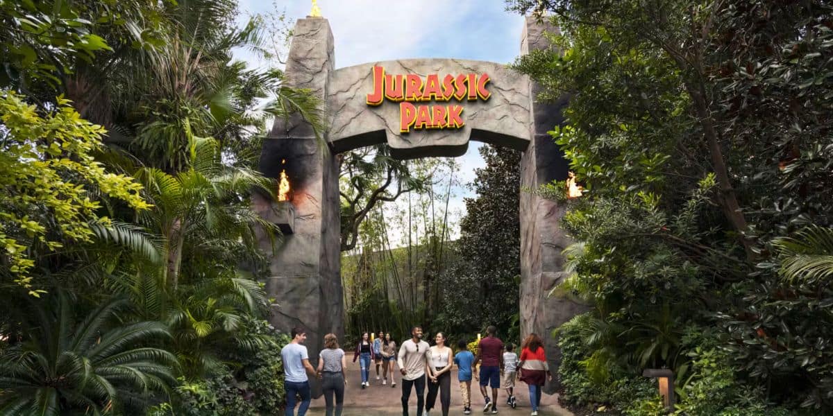 guests pass Jurassic Park gate entrance in Universal Orlando's Islands of Adventure park. Universal Islands of Adventure closures 2026.