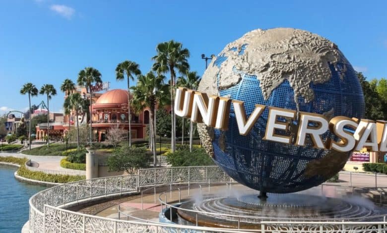 Universal Orlando's iconic spinning globe with Hard Rock Cafe and Islands of Adventure in the distance. Universal Orlando location closure. Universal Orlando guest saves choking woman