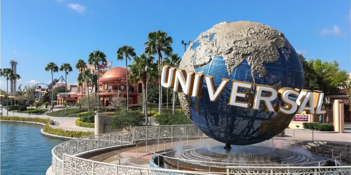 Universal Orlando's iconic spinning globe with Hard Rock Cafe and Islands of Adventure in the distance