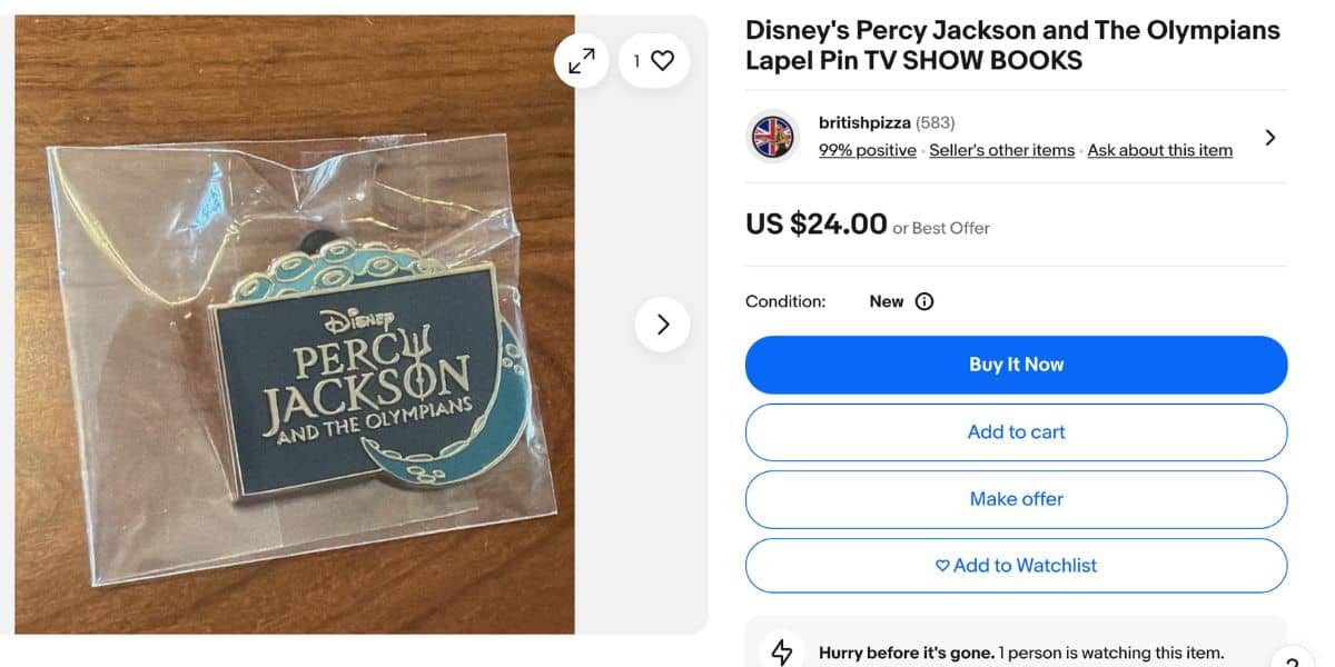Percy Jackson Disney lapel pin in plastic packaging, featured for sale online—after being free at Walt Disney World Resort