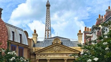 Eiffel Tower and Parisian facades evoke EPCOT’s France Pavilion, with an attraction temporarily closed beneath a cloudy sky.
