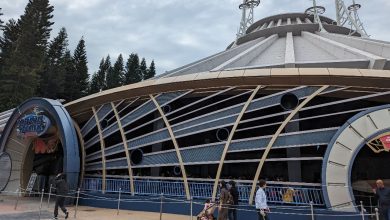 Guests stroll outside Hyperspace Mountain at Hong Kong Disneyland