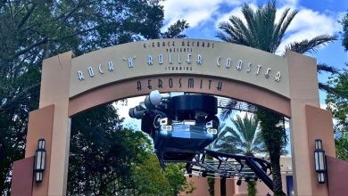 Rock 'n' Roller Coaster archway at Disneyโs Hollywood Studios, framed by palms and blue skyโwatch for exciting attraction updates!.