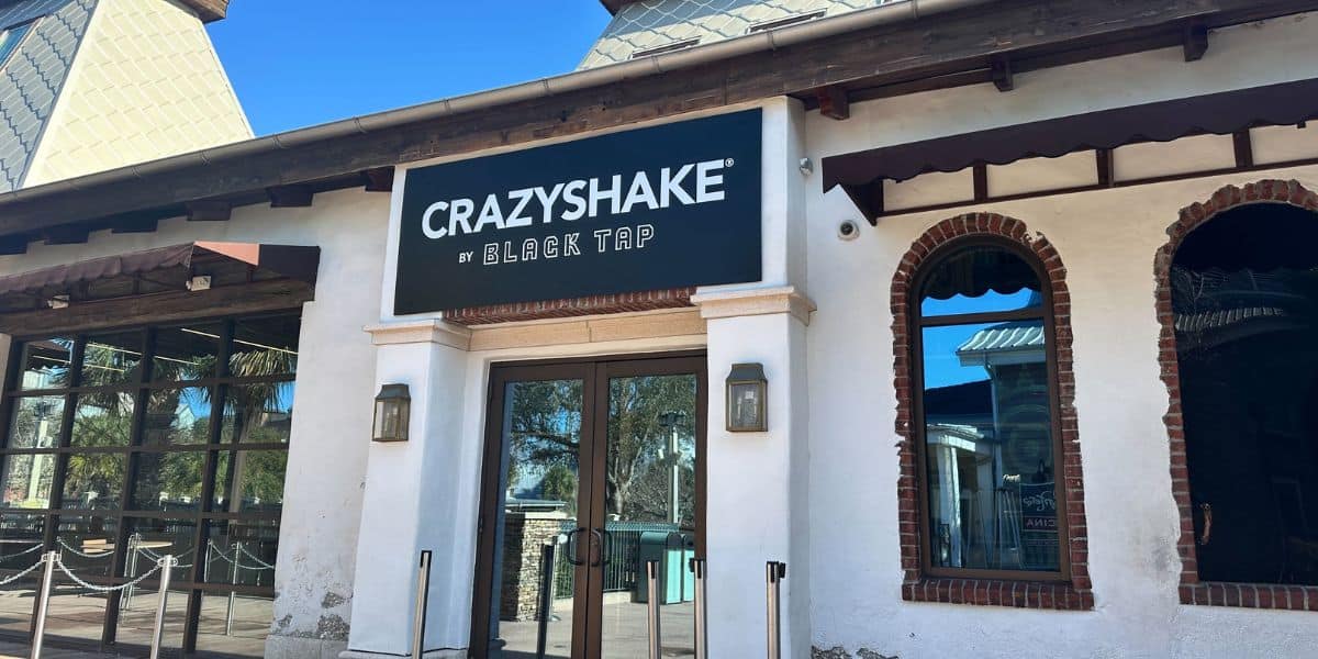 Entrance to CrazyShake by Black Tap at Universal CityWalk, spotlighting its bold marquee above the glass double doors.