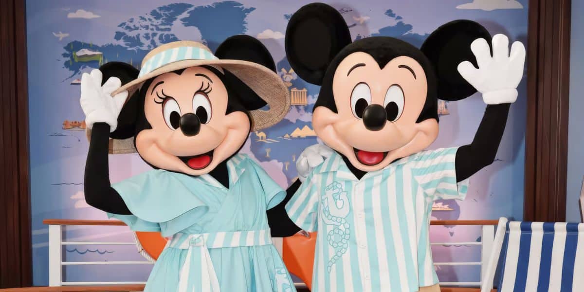 Mickey and Minnie greet guests in their new DVC outifts