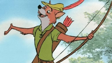 Robin Hood Fox greets guests in his signature green hat and feather, bow and quiver ready, arms wide for photos and hugs.