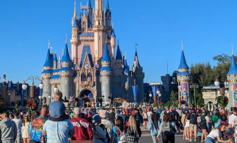 Guests fill the plaza before Cinderella Castle at Disney World. Florida Cyclospora outbreak Disney World