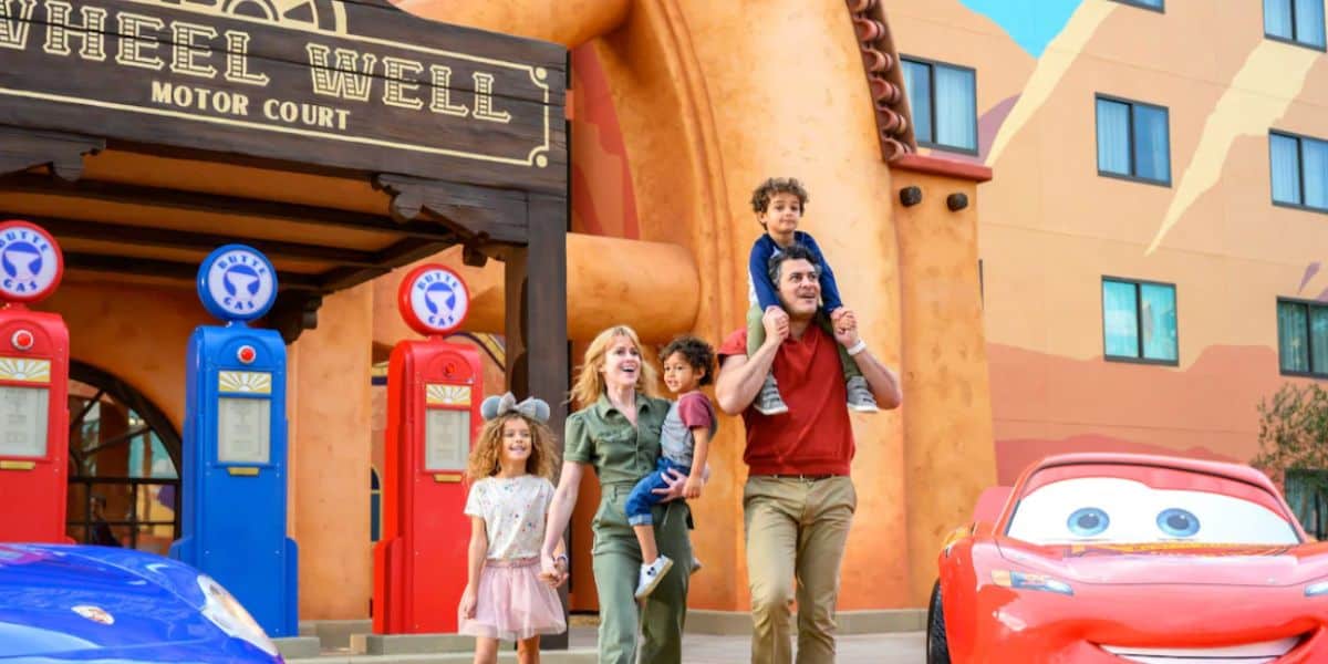 A family in front of Cars section of Disney's Art of Animation Resort hotel