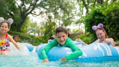 family in lazy river at disney world hotel