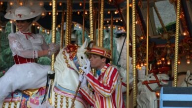 Mary Poppins and Bert on the carousel in Fantasyland at Disneyland Park.