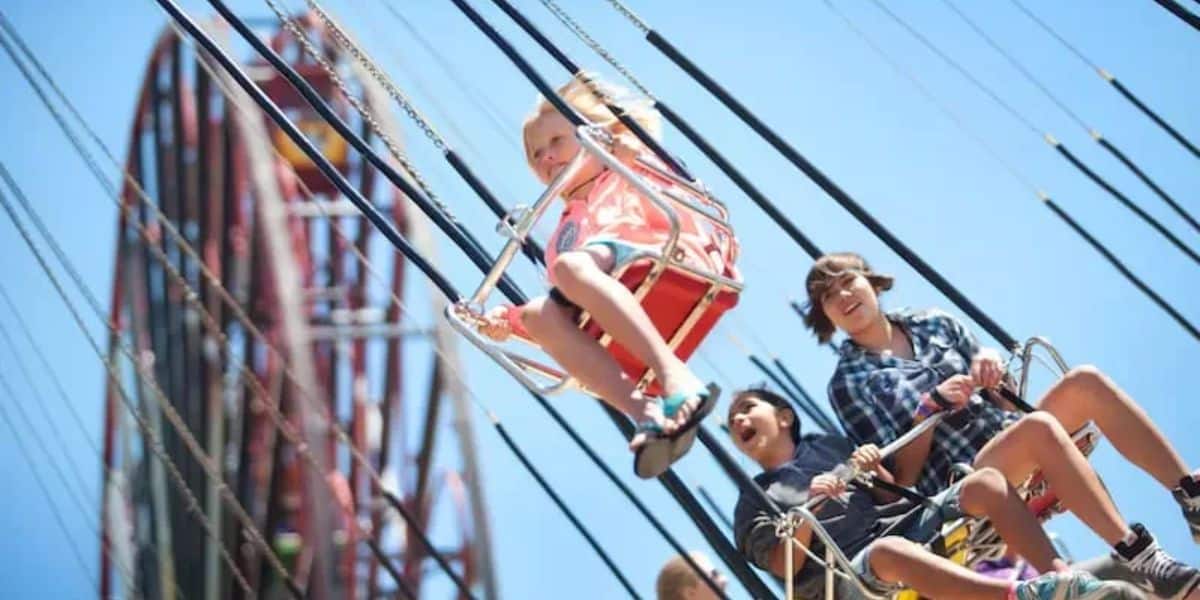 Kids laugh and soar on the Silly Symphony Swings