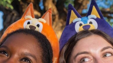 Guests don Bluey and Bingo ear headbands at Animal Kingdom