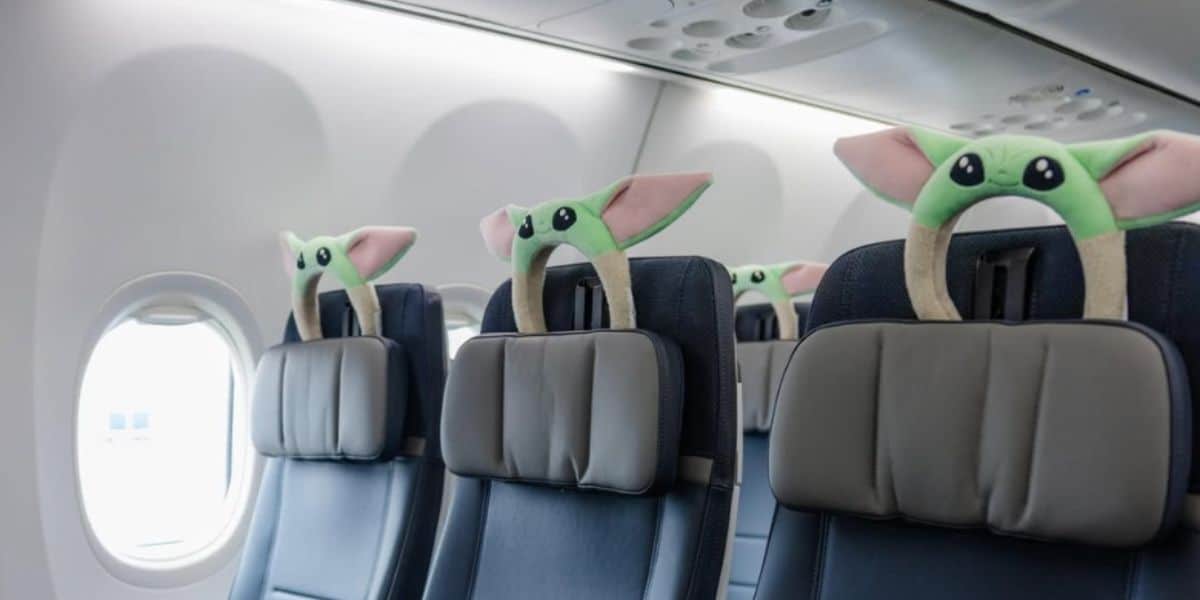 Baby Yoda headrest covers bring Star Wars magic to airplane seats, creating a whimsical in-flight experience for fans.