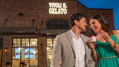 A happy couple savors gelato outside Vivoli Il Gelato at Disney Springs