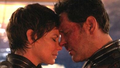 Evangeline Lilly as the Wasp (L) and Paul Rudd as Ant-Man (R) injured and touching heads in 'Ant-Man and the Wasp: Quantumania'