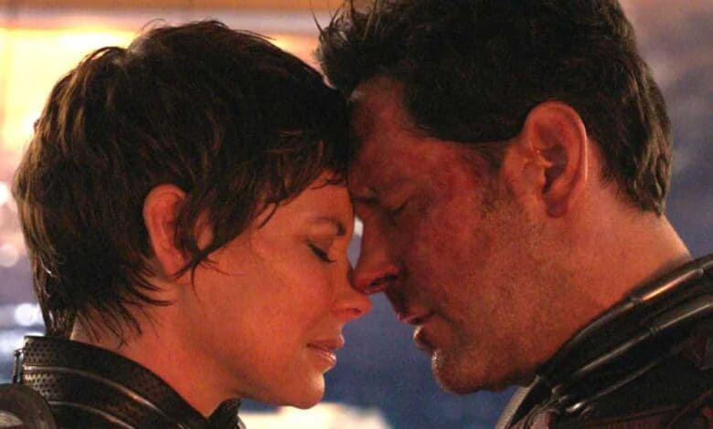 Evangeline Lilly as the Wasp (L) and Paul Rudd as Ant-Man (R) injured and touching heads in 'Ant-Man and the Wasp: Quantumania'