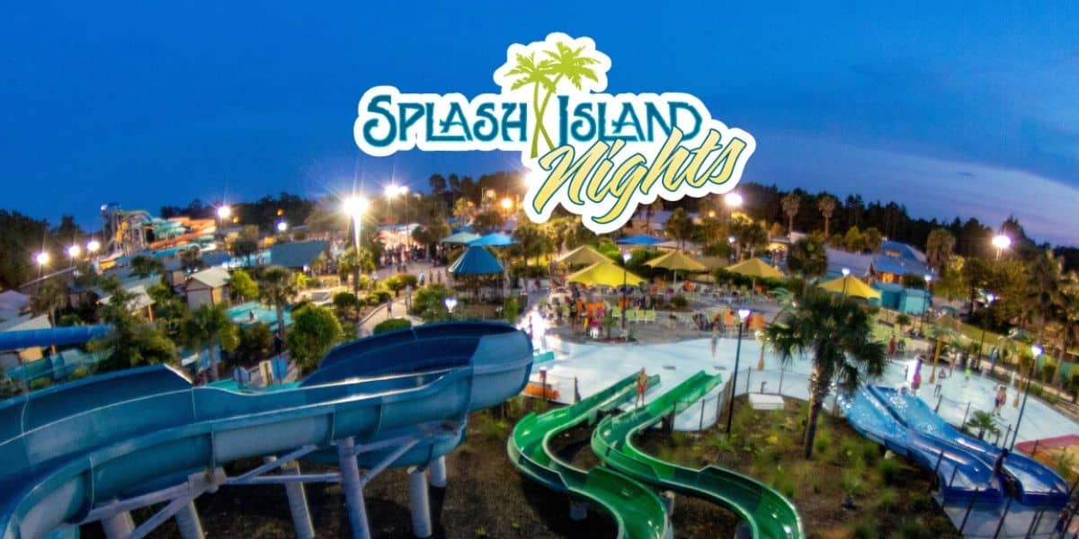 Splash Island Nights water park glowing at dusk with slides, pools, palm trees, and the event logo illuminating the Georgia venue.