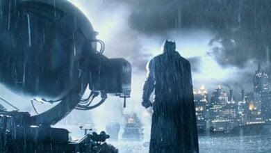 Ben Affleck's Batman on the rooftop next to the Bat signal in 'Batman v Superman: Dawn of Justice'