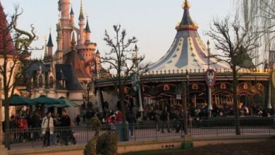 Guests in Fantasyland at Disneyland Paris, including the Carousel.
