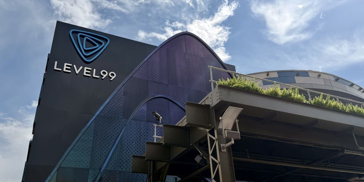 LEVEL99’s bold, geometric facade lights up Disney Springs, promising thrilling new adventures under bright blue skies this summer.